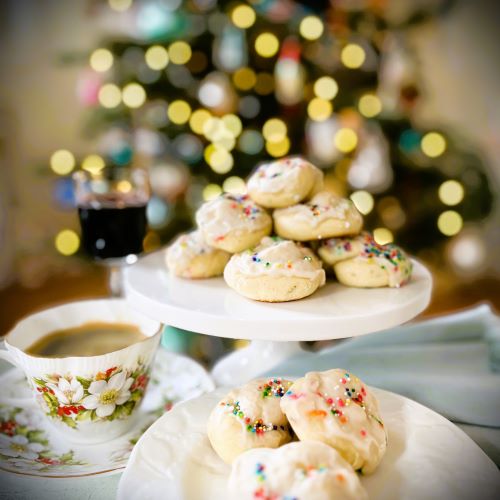 Gluten Free Sweet Italian Taralli Cookies with coffee and wine in front of a Christmas tree