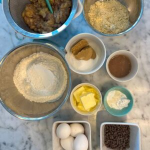 Ingredients for gluten-free Banana Bread: butter, bananas, egg, vanilla, white and brown sugar, gluten-free flour, almond flour, xanthan gum, baking soda and powder, salt, optional mix-ins.