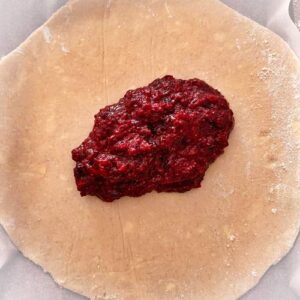 Gluten-Free Summer Berry Apple and Peach Galette - Adding the compote