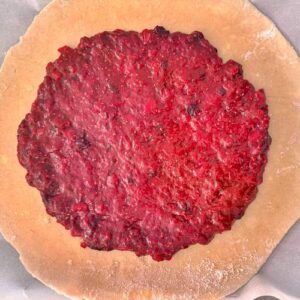 Gluten-Free Summer Berry Apple and Peach Galette - Spreading the compote