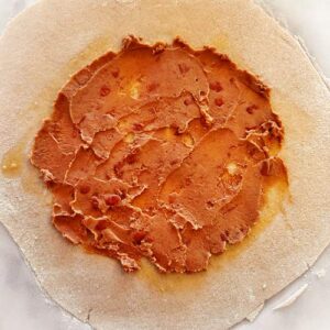 Gluten-Free Taco Salad Galette - Adding Layers - Refried Beans